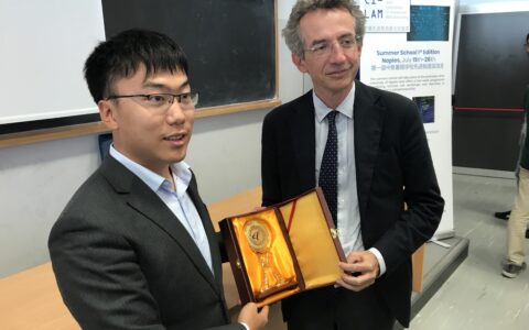 Rector Manfredi with a CI-LAM Student